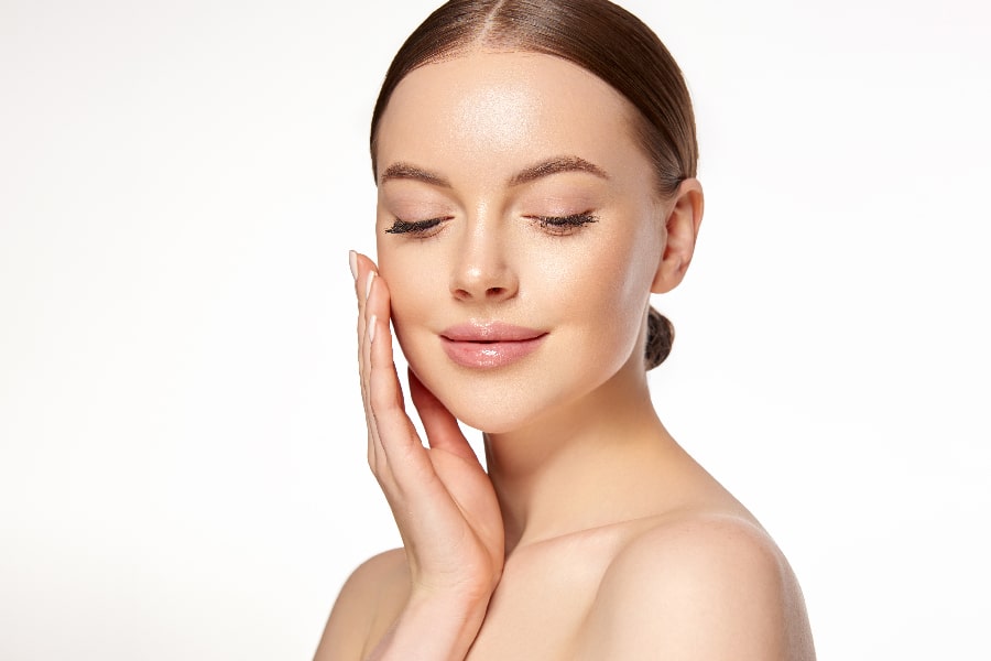 Beautiful Young Woman with Clean Fresh Skin . Facial treatment