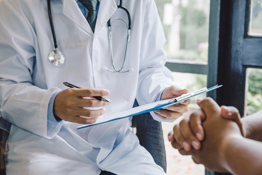 Doctor giving a consultation to a patient and explaining medical