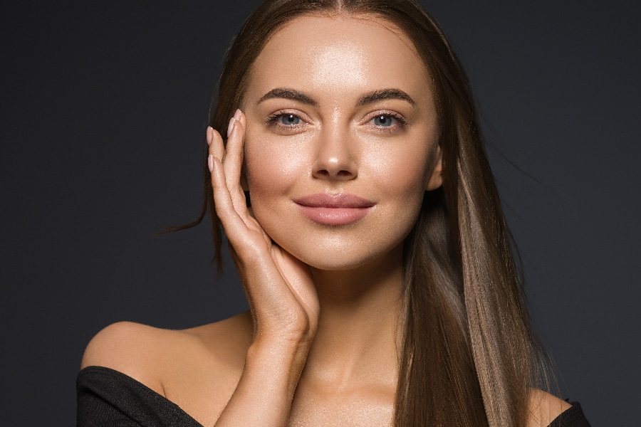 Female face beauty woman long hair fly natural make up clean hea