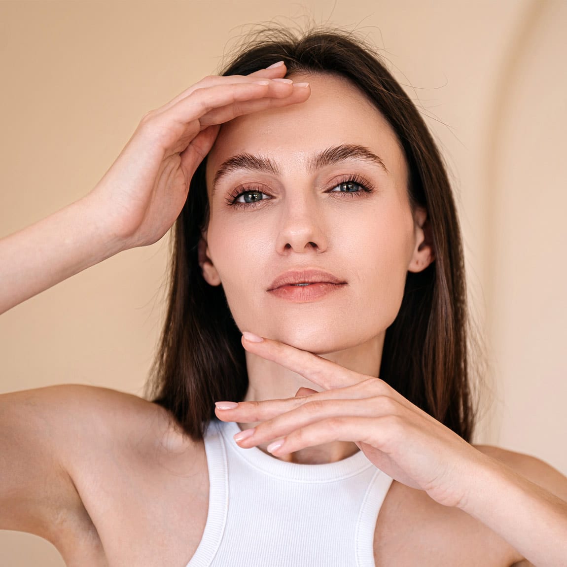 Portrait of young woman posing, looking at camera