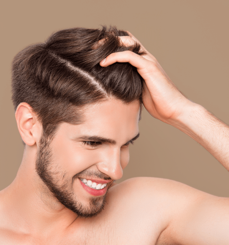 man running his hand through his hair man running his hand through his hair