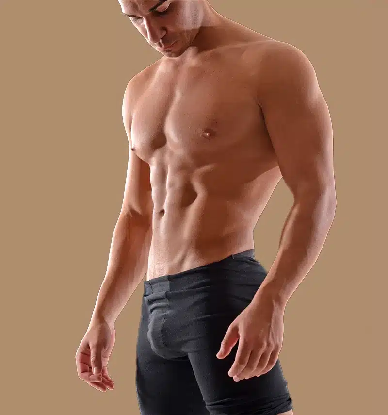 toned fit man looking downward erectile dysfunction